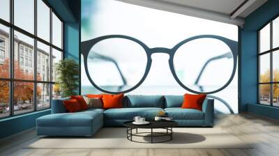 glasses on a white light background,Eye glasses on the white table with sun ray Wall mural