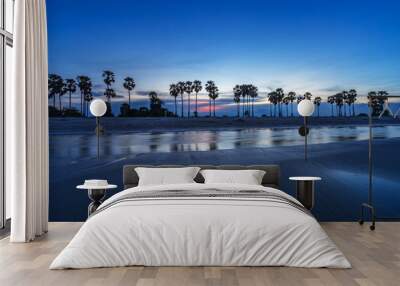 sunset beach and row of palm tree twilight skyline Wall mural