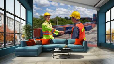 Two foreman shake-hand on box container in cargo site Wall mural