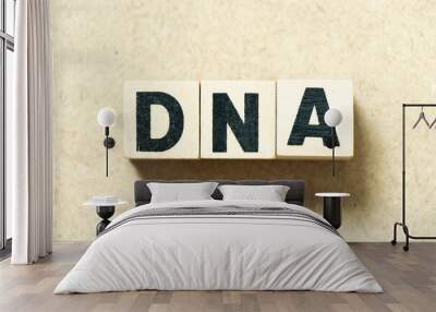 Alphabet letter block in word DNA (abbreviation of Deoxyribonucleic acid) on wood background Wall mural