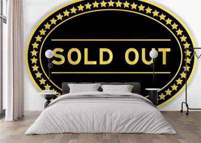 Black and gold color oval label sticker with word sold out on white background Wall mural