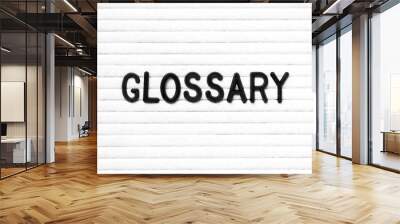 Black color letter in word glossary on white felt board background Wall mural