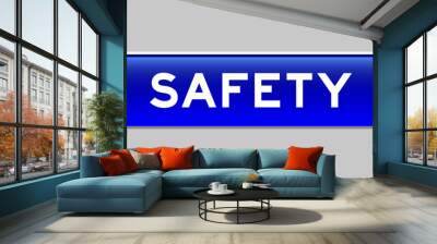 Blue color capsule shape button with word safety on gray background Wall mural