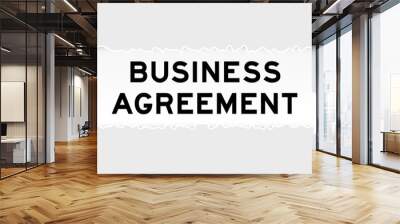 Ripped gray paper background that have word business agreement under torn part Wall mural