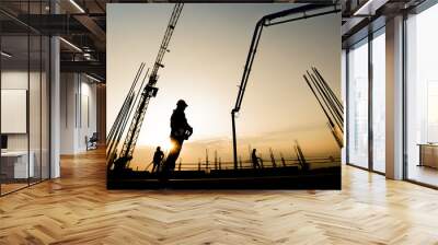 construction worker concrete pouring during commercial concreting floors of building in construction Wall mural