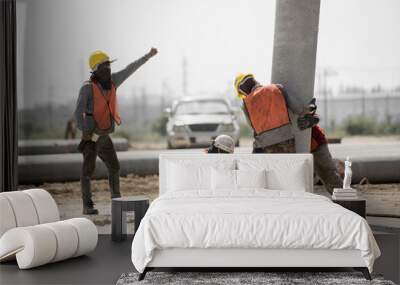 construction worker in construction site safety uniform install construction concrete pile driving for new warehouse foundation construction building work Wall mural