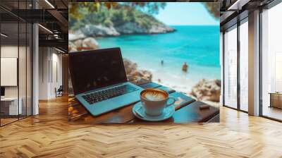 cup of coffee and laptop on table near the beach summer Wall mural