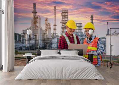 Refinery industry engineer  wearing PPE Working at refinery construction site Wall mural