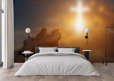 Silhouette of christian open hands to praying for blessing from god at sunset background. Wall mural