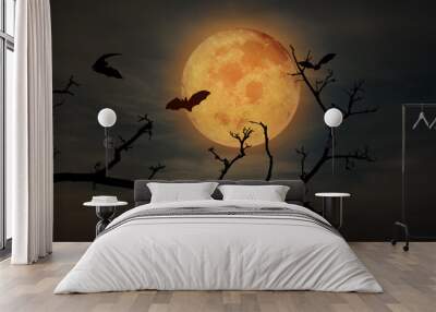 Spooky halloween background with silhouette dead tree and flying bat at night full moon Wall mural