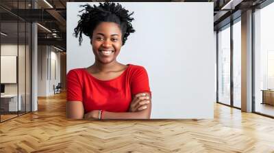 woman arms crossed across her chest, with a confident smile Wall mural