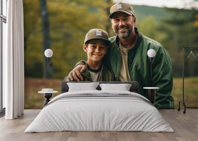 man and son with baseball cap smiling at at baseball stadium. Wall mural