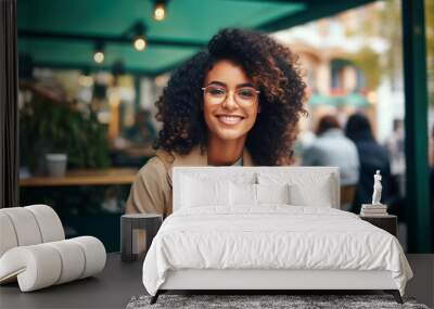 portrait of a woman in a cafe. African American teenage woman with beautiful smile. Wall mural