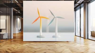 Close-up of two miniature wind turbines on a white surface, one with orange blades and the other with blue blades, against a soft gradient background. Wall mural