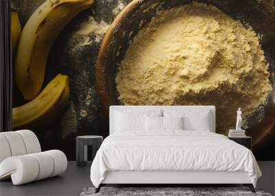 A bowl of flour with two bananas on the side on a rustic wooden surface. Wall mural