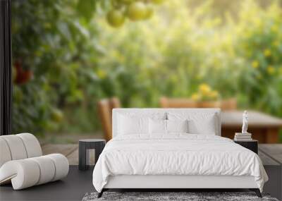 The empty wooden table top with blur background of tomato tre The empty wooden table top with blur background of tomato tree Wall mural