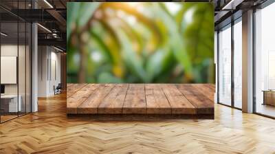 wood plank on blurred banana tree background, empty wood table floors on banana plantation farm organic green fresh nature background, wood table board empty front banana tree background blur
 Wall mural