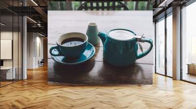 cup of tea and tea pot on table Wall mural