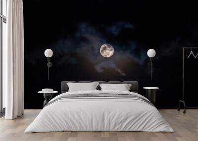 The moon is blocking the clouds. Wall mural