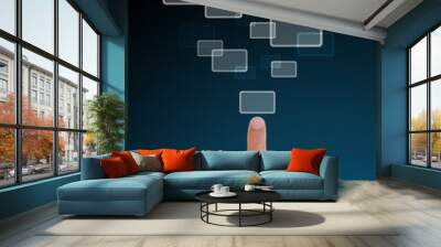 Hand pushing a button on a touch screen interface in wide world. Wall mural