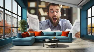 A man with an ecstatic expression holds up a fan of money, capturing the joy of financial success. The background suggests a work environment, adding context to the achievement being celebrated. Wall mural