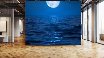 Full moon rising over empty ocean at night Wall mural