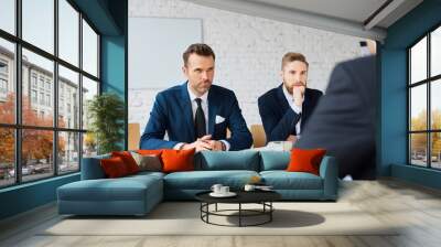 business negotiations - three business man negotiating Wall mural