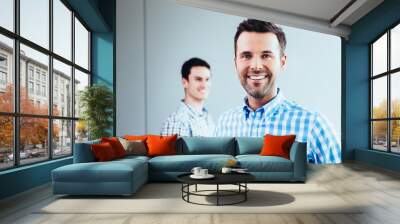 handsome young student looking at camera Wall mural