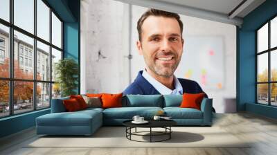 Portrait of happy mid adult businessman Wall mural