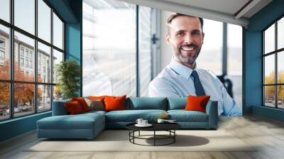 Portrait of successful businessman in modern office Wall mural