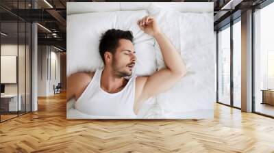 Top view of young attractive man sleeping with mouth open Wall mural