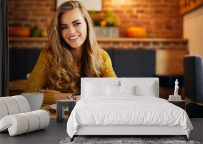 young woman at cafe smiling having cake and coffee Wall mural