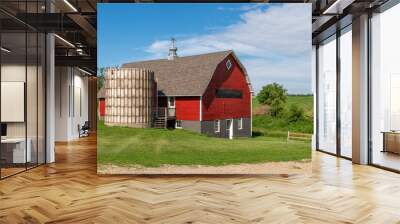 Red barn with brown shingled roof and  old silo on a farm in rural Minnesota, USA.
 Wall mural