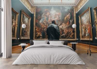 Back of an man looking at renaissance style paintings in a museum  Wall mural