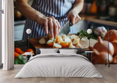 woman slicing onions with knife on a kitchen cutting board   Wall mural