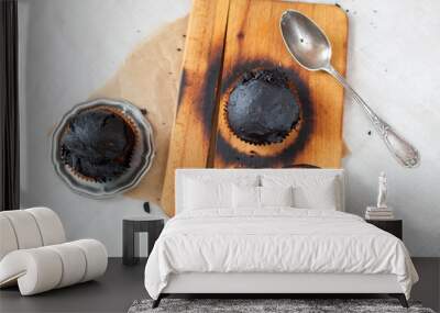 burned muffins - black cupcakes, failed baking, catastrophe in the kitchen, burned on charcoal Wall mural