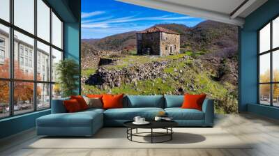 Aerial image of a historical abandoned fortified house build on the top of a rocky hill over 200 years ago in a remote village of northern Albania called Bukmire (in Mirdita region) Wall mural