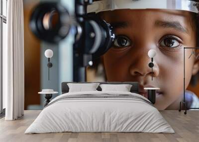 Boy getting an eye exam at clinic. Wall mural