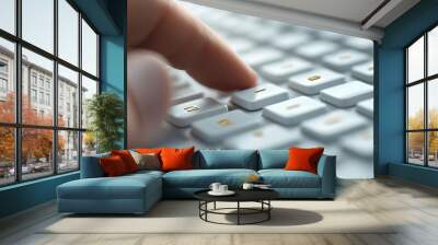 Finger pressing a key on a keyboard Wall mural