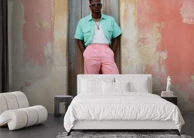 Man in pastel clothing posing against vintage wall Wall mural