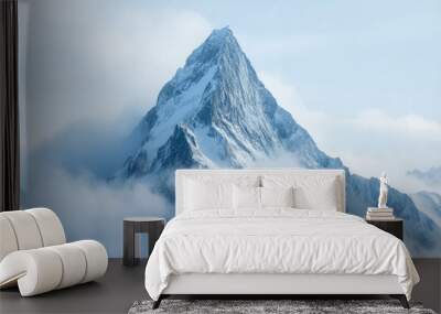 Snow covered mountain peak rises above clouds Wall mural