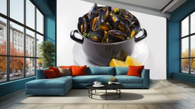 Black pan with cooked with green onion, parsley marinated high quality mussels Wall mural