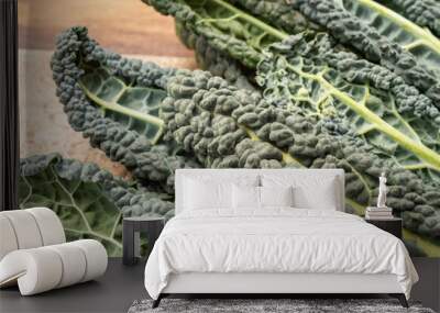 Cooking with black flat leaves of cavolo nero tuscan cabbage Wall mural