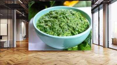 Healthy vegetarian or vegan food, cooked green spinach with cream, ingredient for many dishes like pasta, ravioli or soup Wall mural