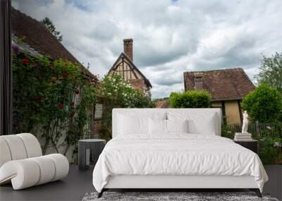 One of most beautiful french villages, Gerberoy - small historical village with half-timbered houses and colorful roses flowers, France Wall mural