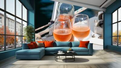 Party with rose wine on yacht boat anchored in port la Rague, Gulf of La Napoule, in Provence, two glasses of cold rose wine, French Riviera near Cannes, south of France Wall mural