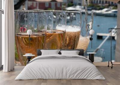 Summer party, French brut rose champagne sparkling wine in flute glasses in yacht harbour of Port Grimaud near Saint-Tropez, French Riviera vacation, Var, France Wall mural