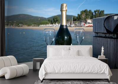 Summer time in Provence, two glasses of cold champagne cremant sparkling wine on famous Pampelonne sandy beach near Saint-Tropez in sunny day, Var department, France, beach club party Wall mural