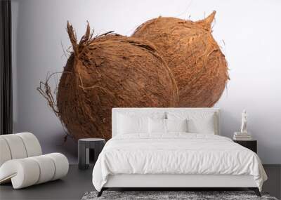 Two big brown whole coconuts close up copy space isolated on white background Wall mural