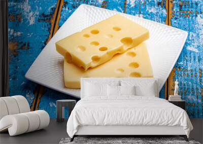 Two blocks of French emmental semi-hard cheese Wall mural